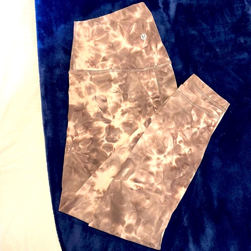Size 4 Lululemon pink and cream multicolored aligne leggings. 25 inch length